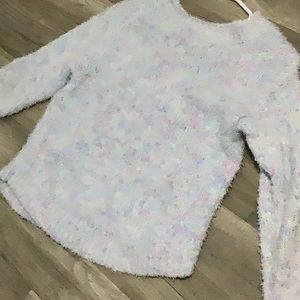 Sweater colors are purple mint and blue